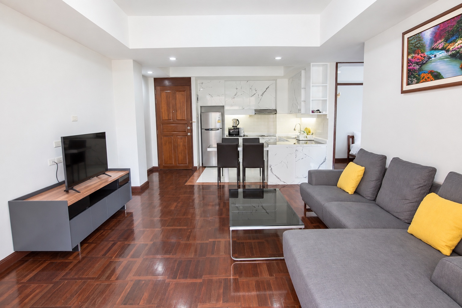 Living and dining space in a two-bedroom apartment at Le Vanvarothai